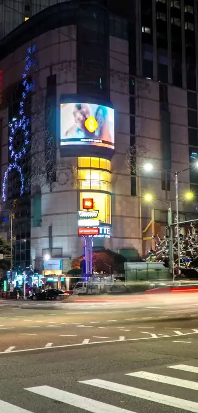 Vibrant city nightscape with bright lights and urban architecture.