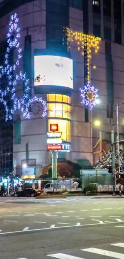 Urban street with illuminated buildings at night.