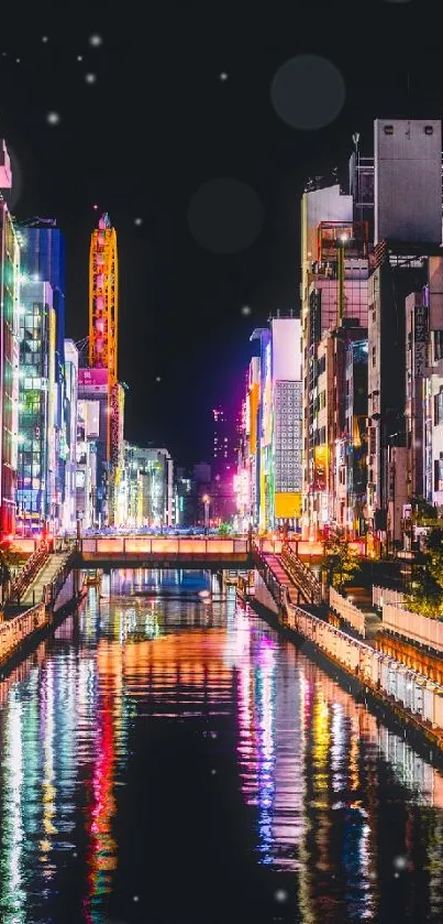 Vibrant city at night with neon reflections on the water.