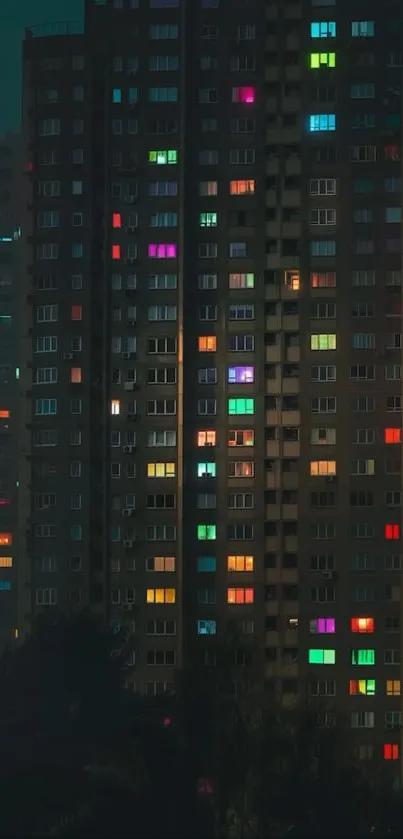 Nightscape with colorful windows and full moon.