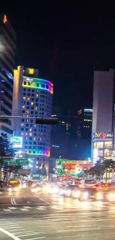 Bustling urban street at night with vibrant city lights.