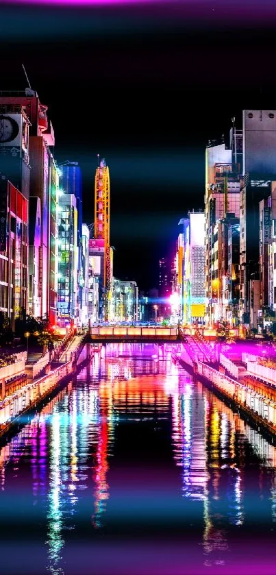 Vibrant city nightscape with colorful lights reflecting on the river.