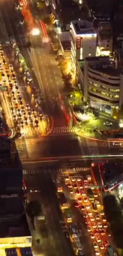 Aerial view of a vibrant city at night with bright lights and busy streets.