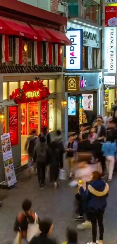 Colorful city street bustling with nightlife and vibrant signs.