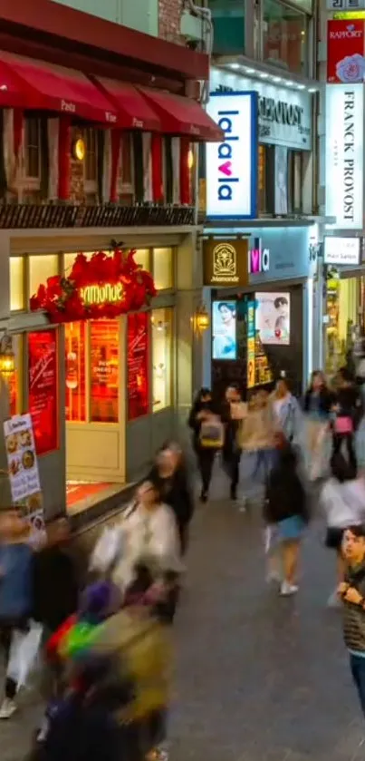 Crowded night city street with colorful lights and vibrant activity.