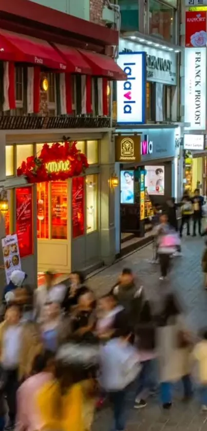 Bustling city street with vibrant signs and lively atmosphere at night.