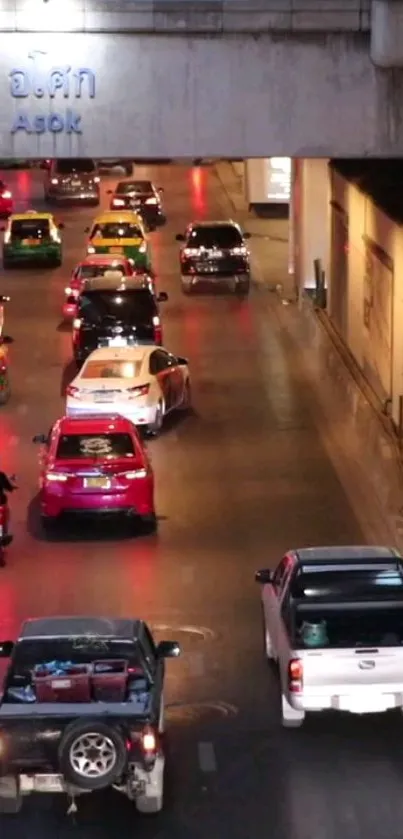 Vibrant city traffic at night with colorful cars.