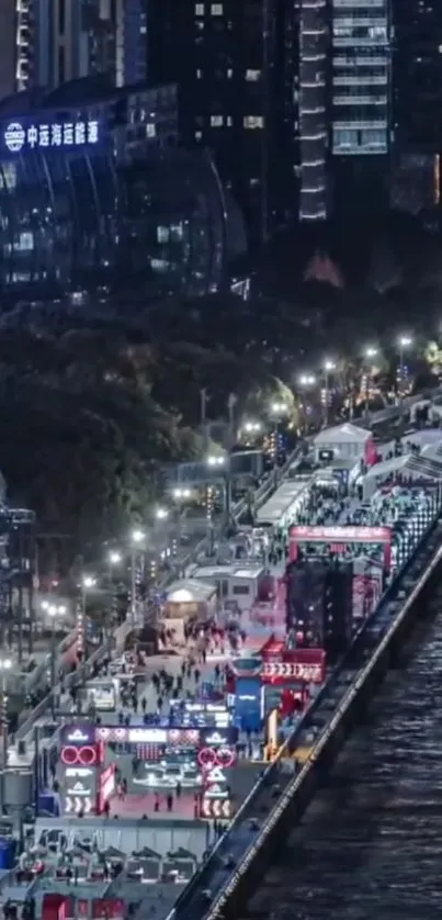 Vibrant urban night view along illuminated river.
