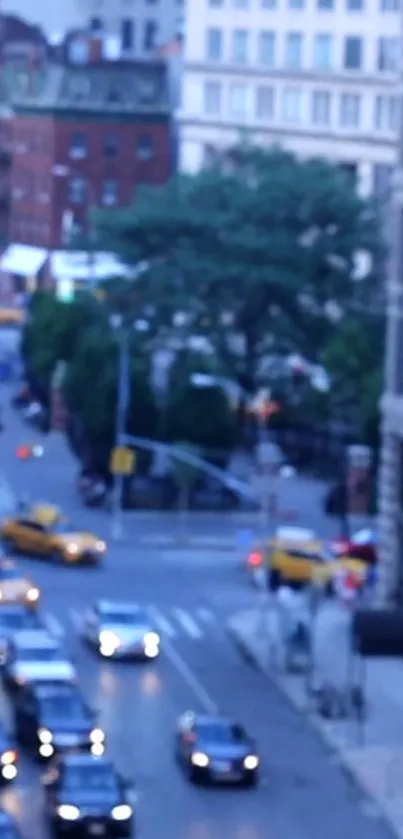 Blurry city street with yellow taxis and evening lights.