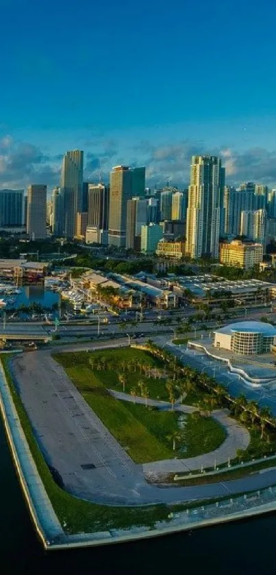 Aerial view of a vibrant cityscape with skyscrapers and a deep blue sky.