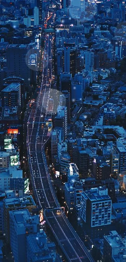 Aerial view of a city at night with vibrant street lights and skyscrapers.