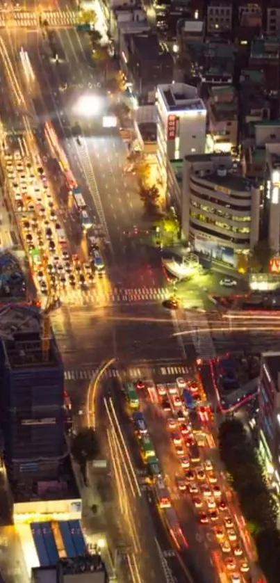 Aerial view of a vibrant cityscape with colorful night lights and dynamic traffic.