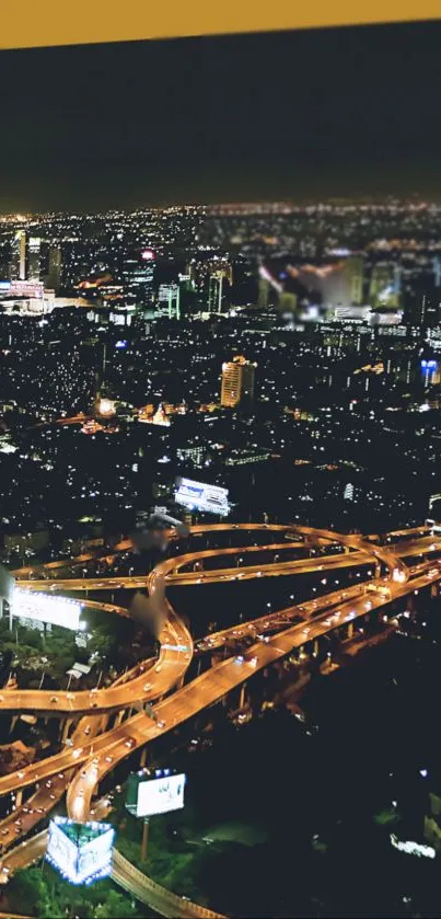 Aerial night view of a vibrant cityscape with illuminated highways.