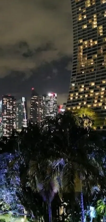 Illuminated cityscape at night with vibrant colors and modern architecture.