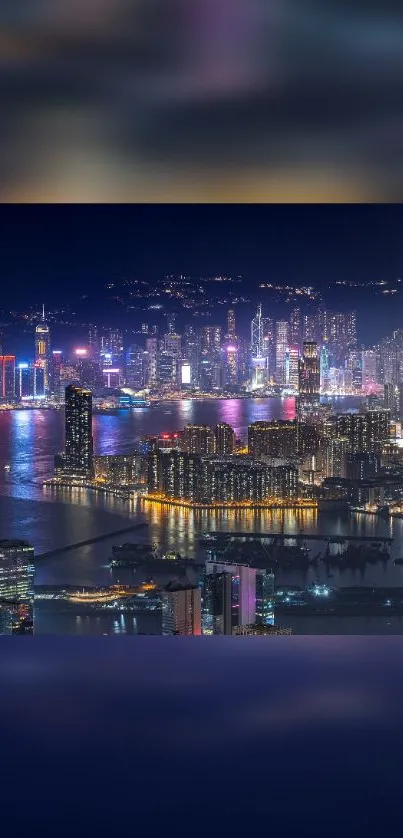 Vibrant city skyline with glowing lights over a reflective river at night.