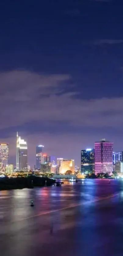 Vibrant city skyline reflecting at night.