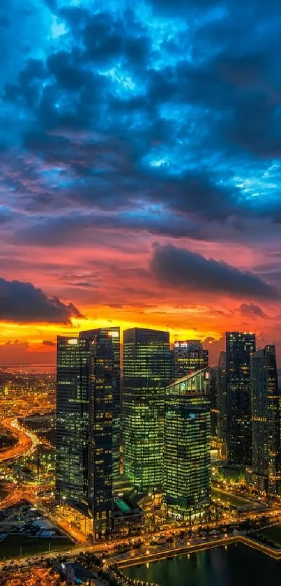 Dramatic sunset view over modern cityscape with illuminated buildings and colorful sky.