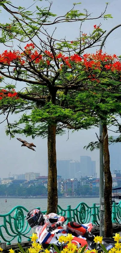 Cyclist rides under flowering trees in vibrant cityscape.