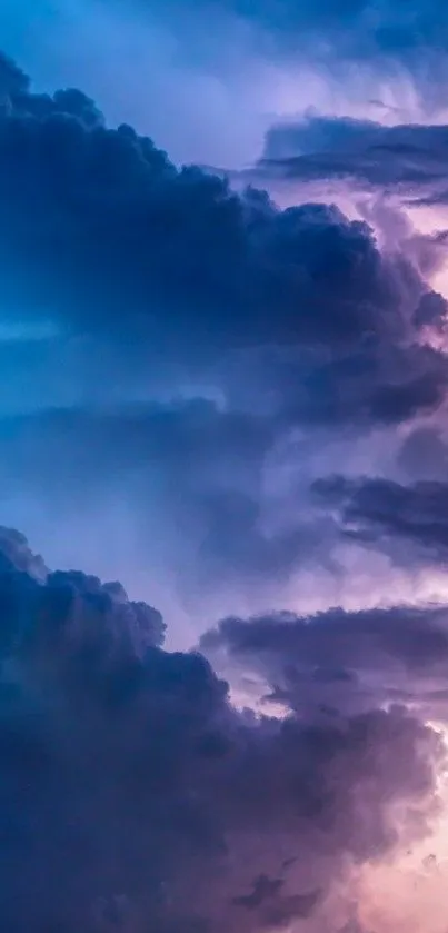 Vibrant cloudy sky wallpaper with blue and purple hues.