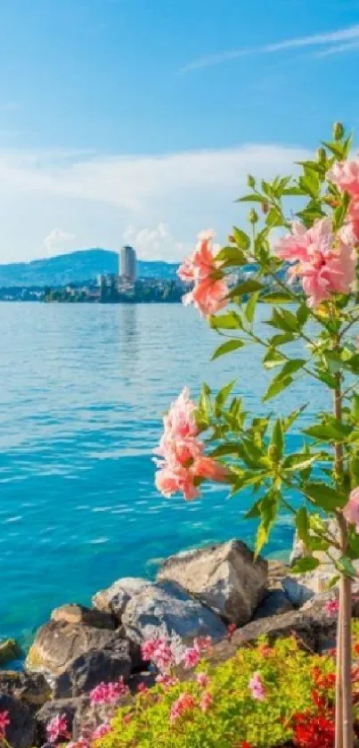 Beautiful view of pink flowers against a vibrant blue ocean and sky.