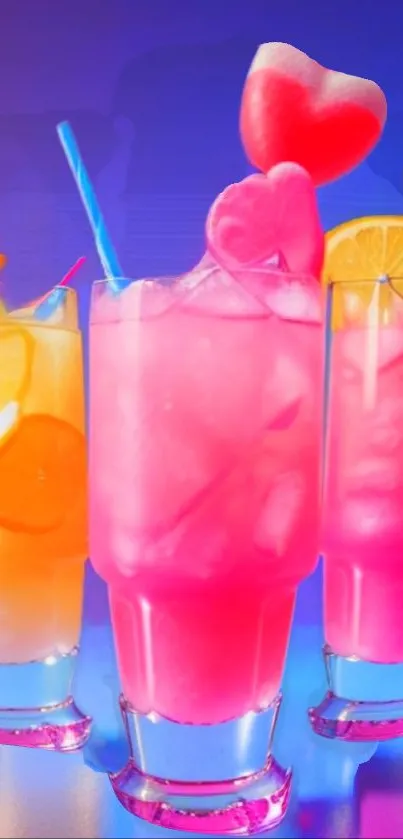 Vibrant neon drinks with pink and orange hues and fruit slices in glass.