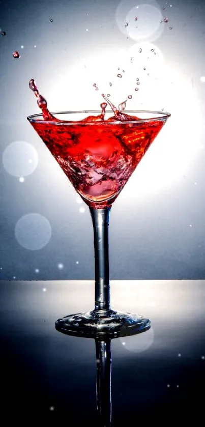 A vibrant red cocktail splashing in a glass against a dark background.