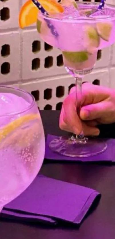 Vibrant cocktail glasses with fruit garnishes on a stylish table.