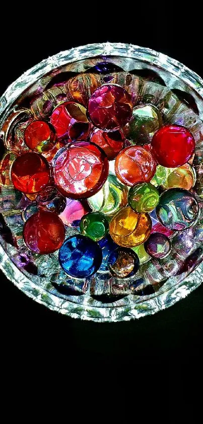 Vibrant arrangement of colorful glass orbs on a dark background.