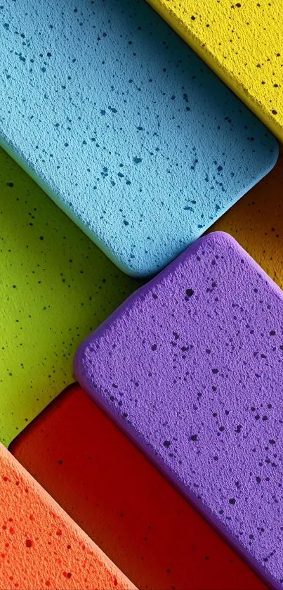 Vibrant geometric wallpaper with colorful blocks in blue, yellow, red, and purple hues.