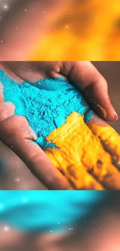 Vibrant hand holding bright teal and yellow powders.