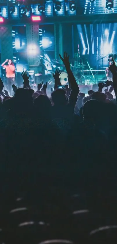 Energetic crowd enjoying a live concert with blue stage lighting.