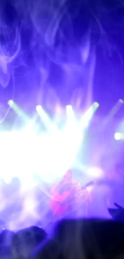 Dynamic concert scene with vivid blue and purple lights creating an energetic atmosphere.