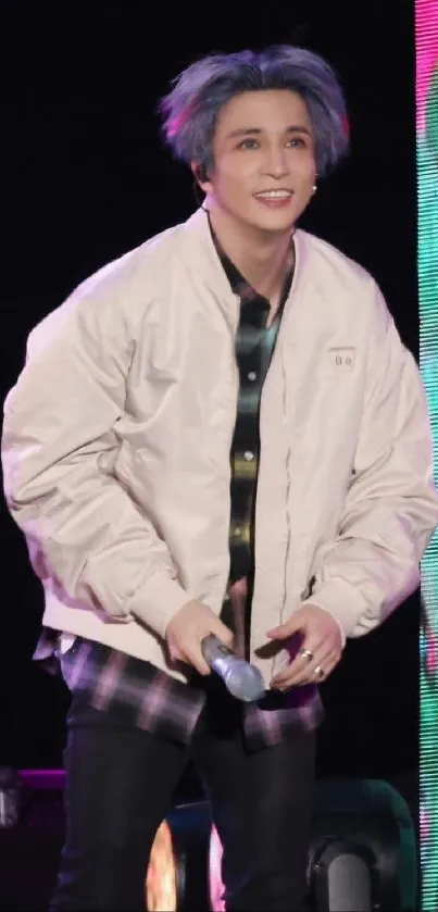 Energetic concert wallpaper with performer on stage.