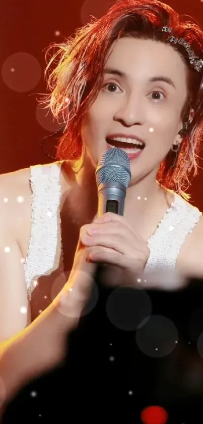 Energetic concert performer holding microphone with vivid curly red hair.