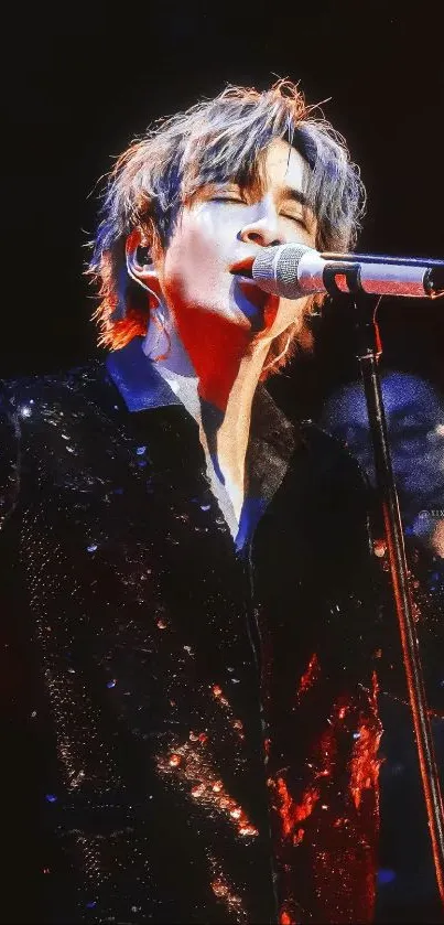 Passionate singer performing vibrantly on stage with dazzling lights.