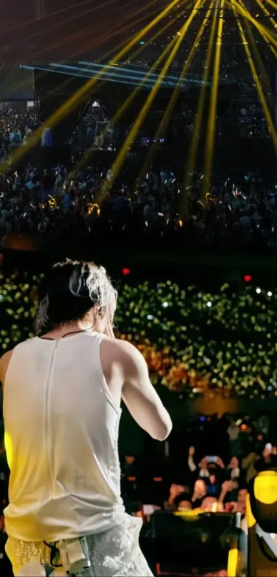 Concert scene with vibrant golden stage lights and lively audience.