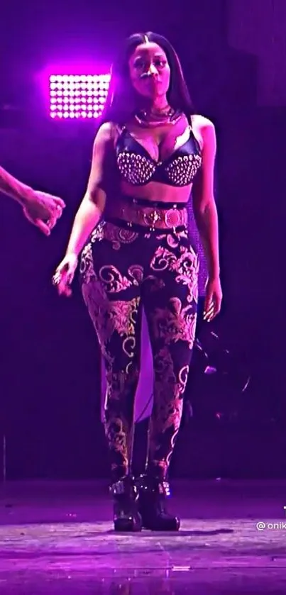 Girl on stage with purple lights and ornate leggings in a concert setting.