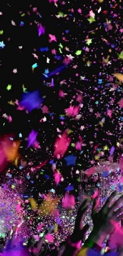 Vibrant confetti burst with colorful lights at a lively celebration event.