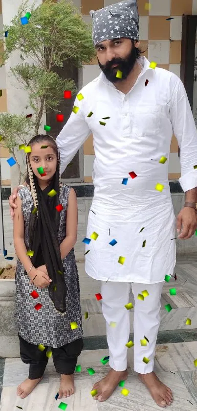 People standing with confetti in vibrant festive attire.