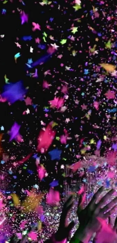 Vibrant confetti and hands reaching up in a celebration scene.