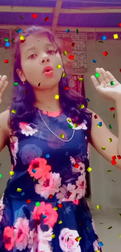 Girl in a floral dress with colorful confetti background.