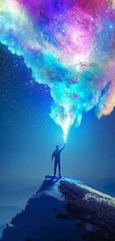 Person on a mountain under a colorful cosmic sky.