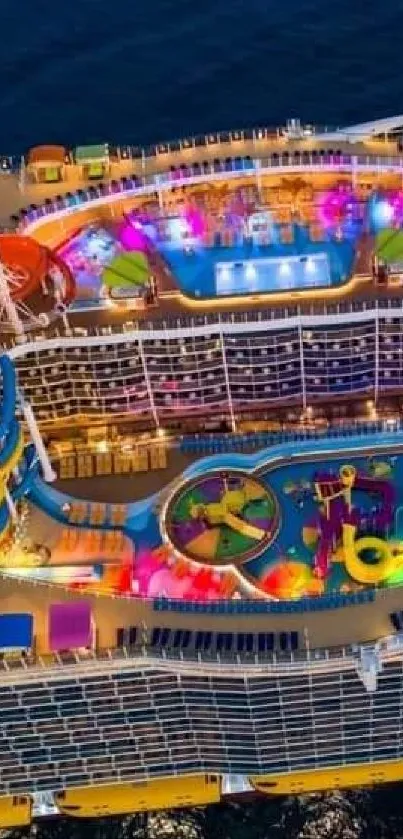 Aerial view of a colorful cruise ship deck, vibrant and illuminated at night.