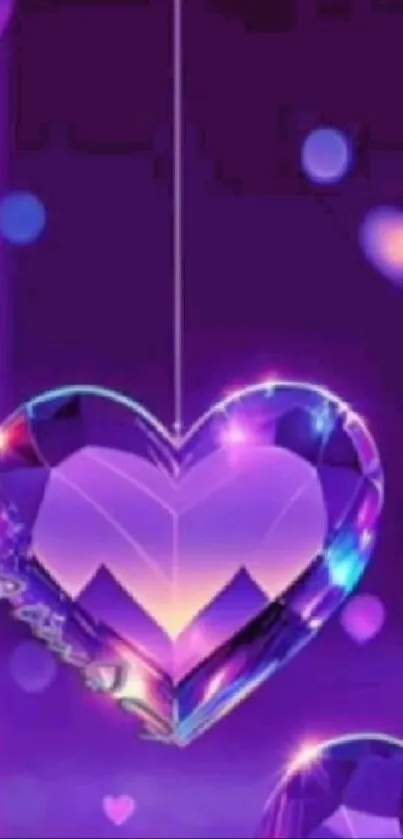 Purple crystal heart with glowing hues on wallpaper.