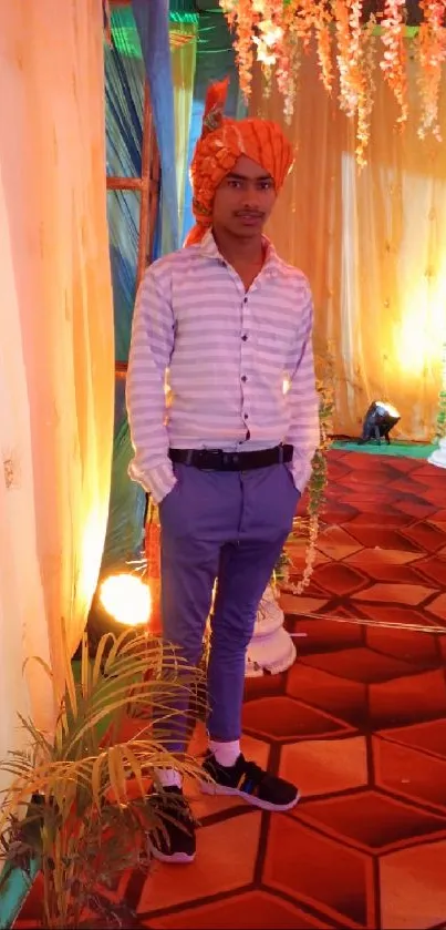 Portrait of a person in traditional attire at a vibrant event setting.