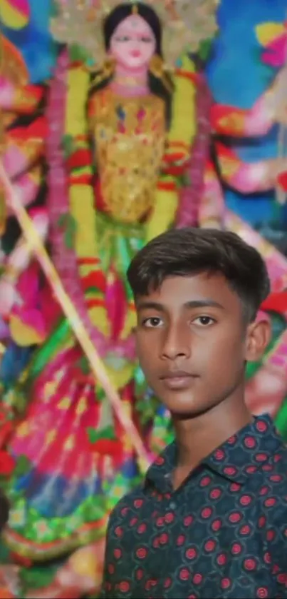 Young person at vibrant cultural festival with colorful deity.