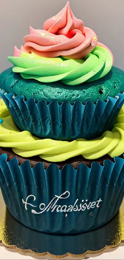 Colorful cupcake with vibrant frosting on turquoise base.