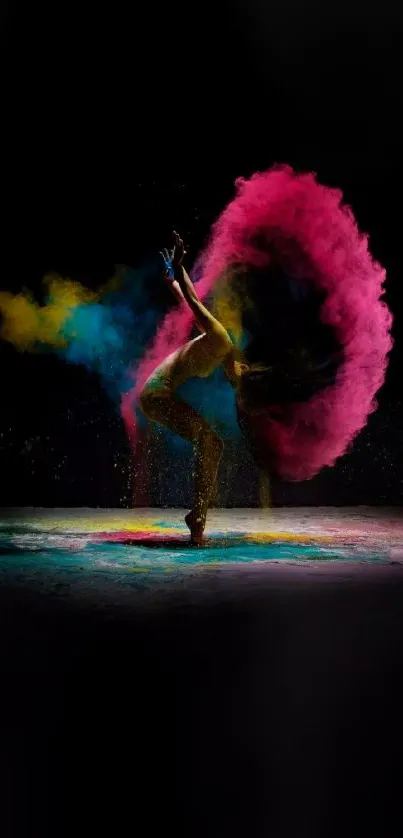 Dynamic dancer with colorful powder explosion on black background.