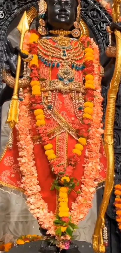 Colorful deity adorned with flowers and vibrant attire.