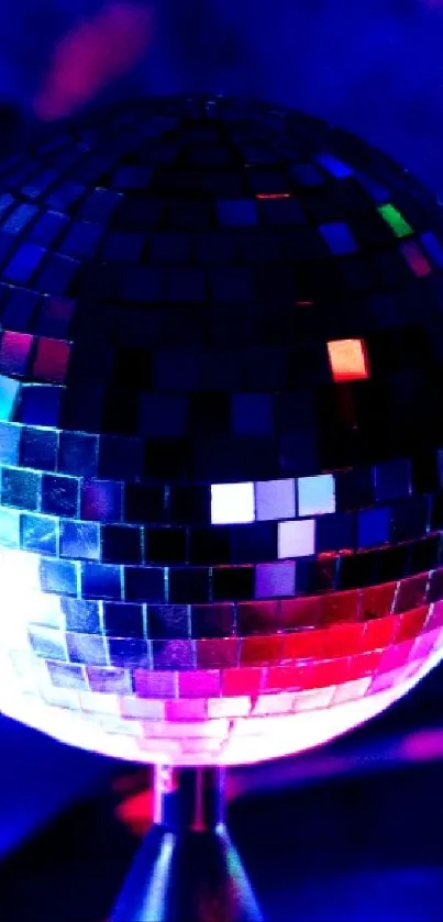 Vibrant disco ball reflecting colorful lights.